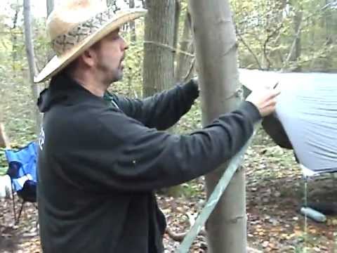 Man hanging hammock with cinch buckle complete suspension