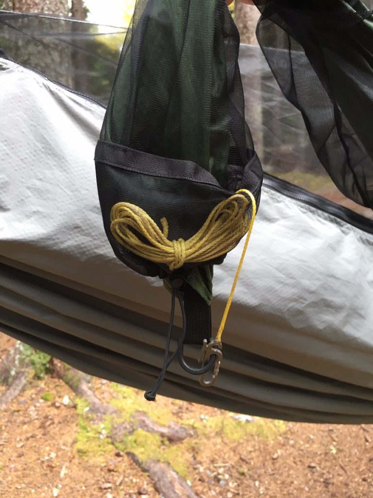 Snakeskin Tarp Sleeve hung next to hammock